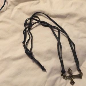 Black leather adjustable necklace with brass cross